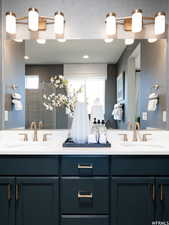 Bathroom with vanity and a shower with shower door