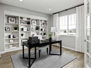 Home office featuring french doors and wood-type flooring