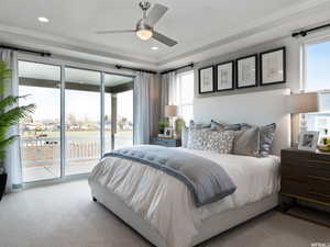 Carpeted bedroom with crown molding and access to exterior