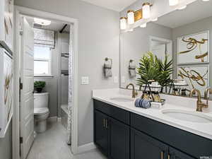 Full bathroom featuring vanity, toilet, and shower / bathing tub combination