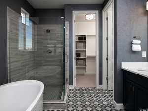 Bathroom with vanity and independent shower and bath