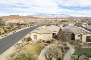 Aerial perspective of suburban area with a mountain backdrop