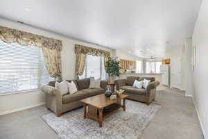 Living room featuring light colored carpet