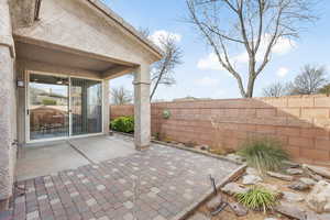 View of patio with fence