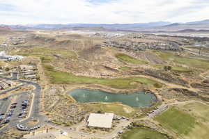 Drone / aerial view featuring a water and mountain view