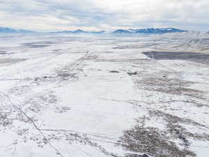 Snowy aerial view with a mountain view