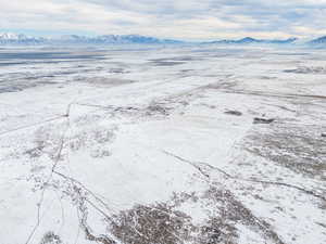 Snowy aerial view with a mountain view