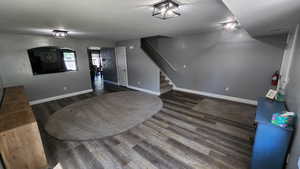 Interior space with dark hardwood / wood-style flooring