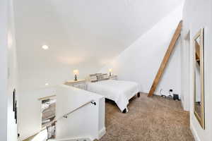 Bedroom with light colored carpet