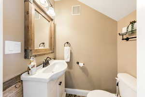 Bathroom with vanity and toilet