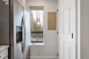 Doorway to outside featuring electric panel