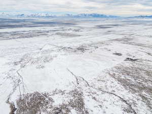 Snowy aerial view with a mountain view