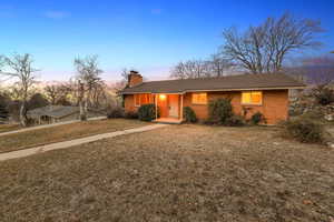 View of front of home with a yard