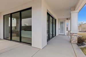 Entrance to property featuring a patio