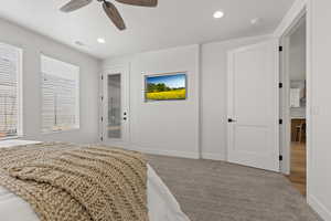 Carpeted bedroom with ceiling fan