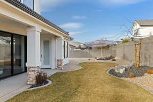 View of yard featuring a mountain view and a patio