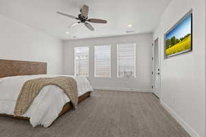 Bedroom featuring ceiling fan and carpet