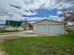 Exterior space featuring a yard and oversized garage