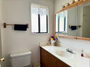 Bathroom in owner suite, featuring vanity and toilet