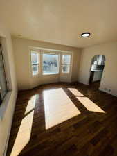 Spare room featuring dark hardwood / wood-style flooring
