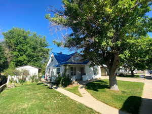 View of front of property with a front yard