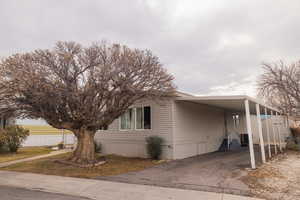 View of front of home featuring a carport