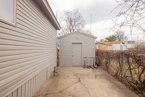 Exterior space with a storage shed