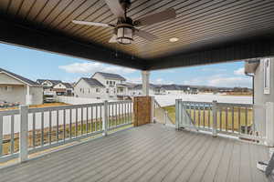 Wooden terrace with a yard and ceiling fan