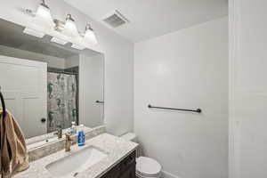 Bathroom with vanity and toilet