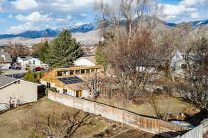 Birds eye view of property with a mountain view