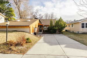 Exterior space featuring a front lawn