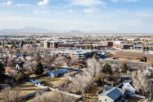 Birds eye view of property with a mountain view