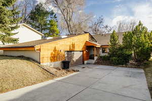 View of side of home featuring a garage