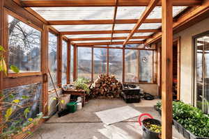 Sunroom with beam ceiling