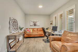 Office space featuring light wood-type flooring