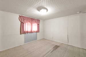 Empty room with carpet flooring