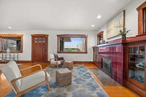 Sitting room featuring hardwood / wood-style floors and a fireplace