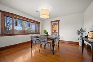 Dining area with hardwood / wood-style flooring