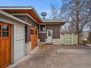 View of patio with a garage