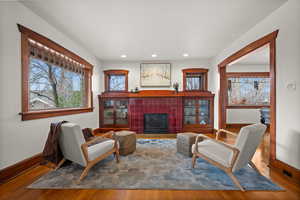 Sitting room featuring hardwood / wood-style flooring and a fireplace