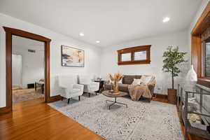 Living room with light hardwood / wood-style flooring