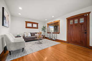 Living room with light hardwood / wood-style flooring