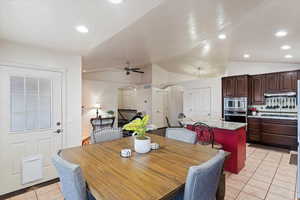 Dining space with a textured ceiling and light tile patterned floors