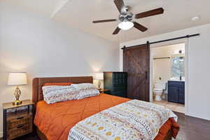 Living room with ceiling fan, light carpet, and a textured ceiling