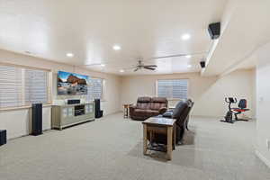 Full bathroom featuring shower / tub combo with curtain, vanity, toilet, and a textured ceiling