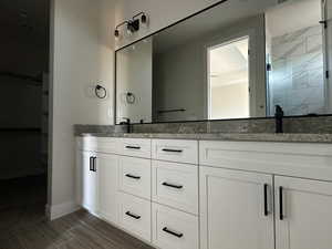 Bathroom featuring vanity and walk in shower