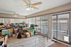 Sunroom with a ceiling fan