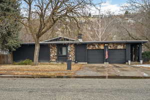 View of front of home featuring a garage