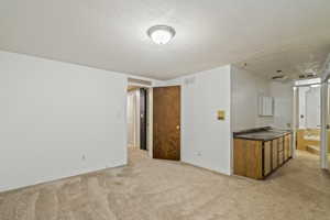 Interior space featuring a textured ceiling