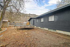 View of yard with a trampoline